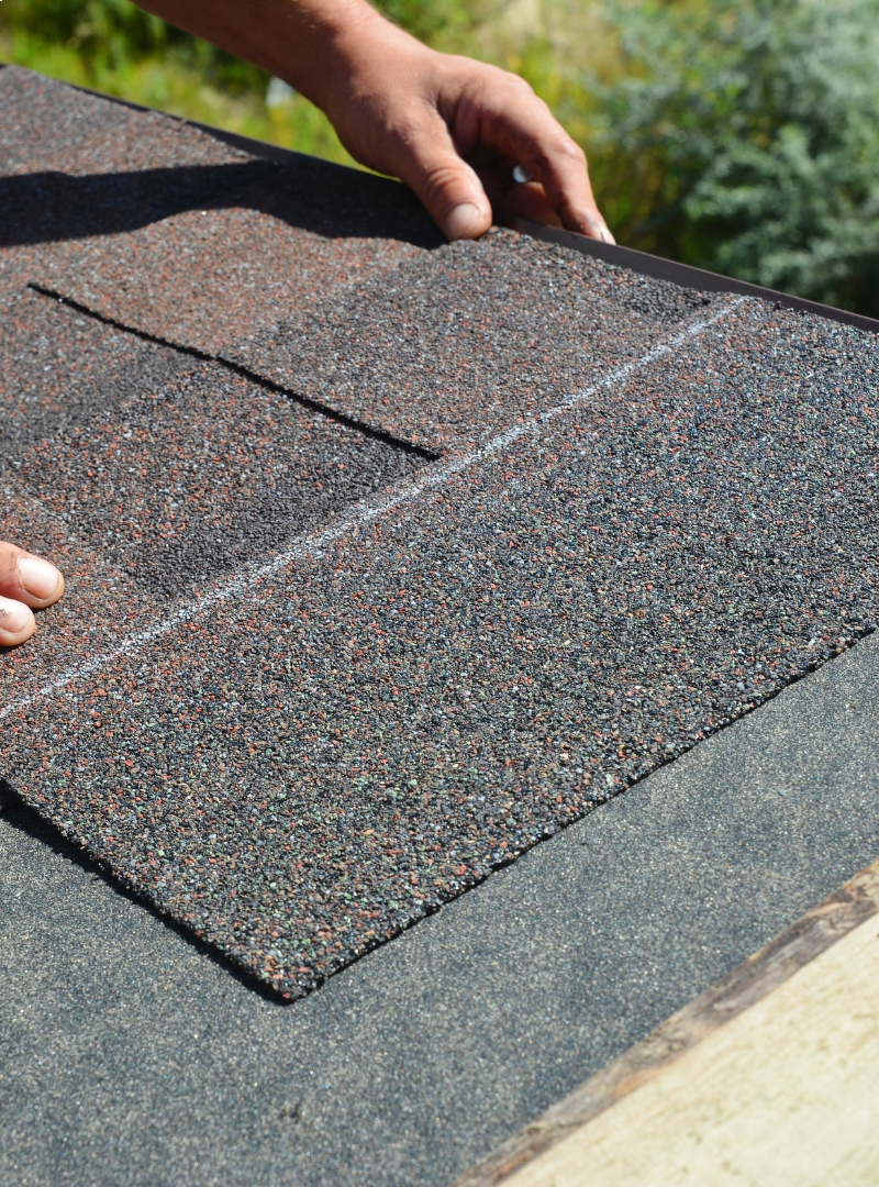 shingle roof being laid